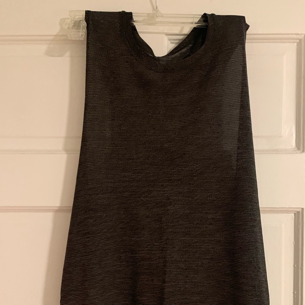 Lululemon Size 4 Tank in VGUC.  Grey on grey stripes. Racer back. Looser fit.